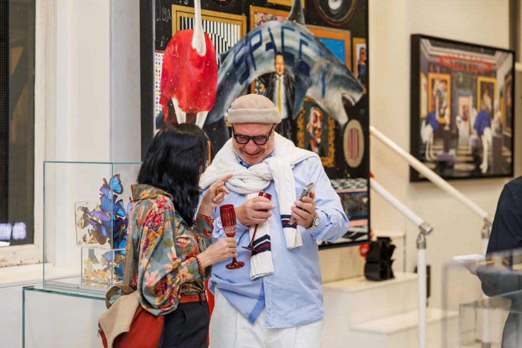 Guests with Yoel Benharrouche during The Garden of Eden exhibition