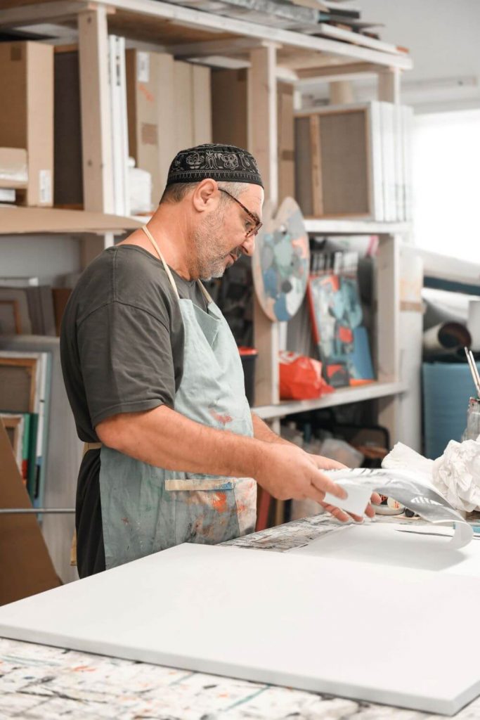 Yoel Benharrouche preparing materials in his studio